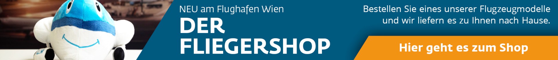 Werbebanner für den Fliegershop am Flughafen Wien mit einem lächelnden Plüschflugzeug und dem Text: 'Neu am Flughafen Wien – Der Fliegershop. Bestellen Sie eines unserer Flugzeugmodelle und wir liefern es zu Ihnen nach Hause. Hier geht es zum Shop.