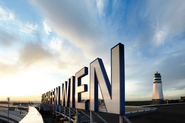 Exterior view of terminal building ‘Flughafen Wien’ lettering / tower in background