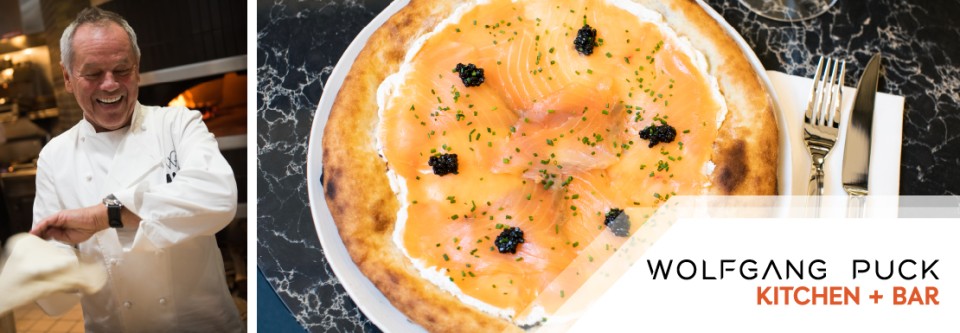 World-class flavours by Wolfgang Puck. Experience gourmet delights like smoked salmon pizza at Wolfgang Puck Kitchen + Bar.